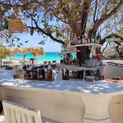 a bar on the beach with a view of the ocean at Eco Del Mar in Pedernales