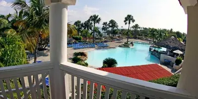 a view of a pool from a balcony of a resort at Lifestyle Tropical Beach Resort & Spa All Inclusive in San Felipe de Puerto Plata