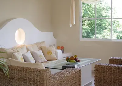 a living room with a couch and a table at Lifestyle Crown Residence Suites in San Felipe de Puerto Plata