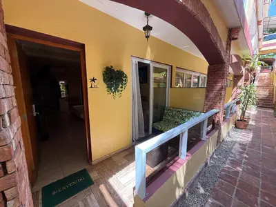 an entry to a building with a door and a porch at Sosua Inn Hotel in Sosúa