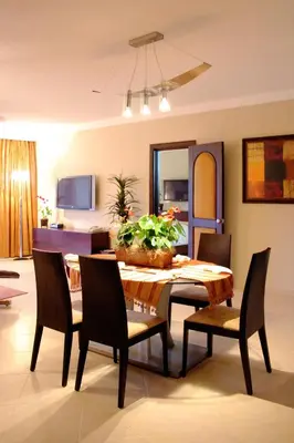a dining room with a table and chairs at Presidential Suites by Lifestyle Puerto Plata - All Inclusive in San Felipe de Puerto Plata