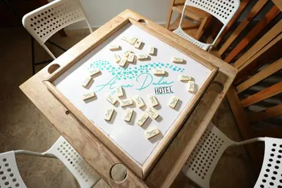 a table with a birthday sign on top of a chair at Hotel Agua Dulce in Boca Chica