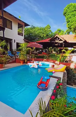 a swimming pool with inflatables in a resort at Villa Bayacanes con piscinas privadas in Jarabacoa