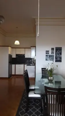 a dining room with a glass table and chairs at Villa Florencia in Boca Chica