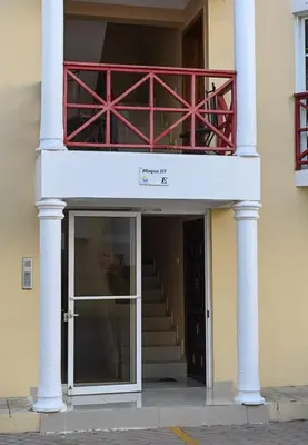 a building with a balcony on top of it at Bellomar I Exclusive Juan Dolio Playa Hemingway in Juan Dolio