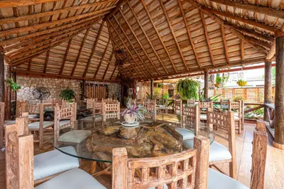 a dining room with a table and chairs at Vista de Águilas Ecolodge in Pedernales