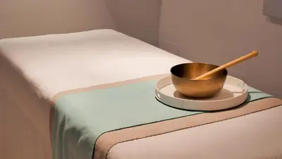 a bowl on a plate on top of a bed at Barceló Santo Domingo in Santo Domingo