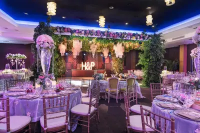 a wedding banquet with purple tables and chairs at Barceló Santo Domingo in Santo Domingo