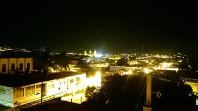 a view of a city at night with lights at Luxury Karla Apartments in Las Flores
