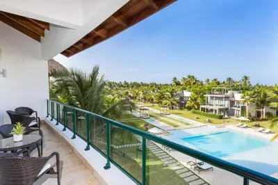 a view of the pool from the balcony of a villa at Apartment in Sublime Samana Résidence in Las Terrenas