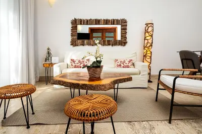 a living room with a couch and a table at Apartment in Sublime Samana Résidence in Las Terrenas