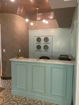 a kitchen with a blue island in a room at Hotel Conde de Penalba in Santo Domingo