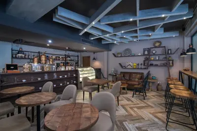 a restaurant with tables and chairs and a bar at Emotions by Hodelpa Puerto Plata in San Felipe de Puerto Plata