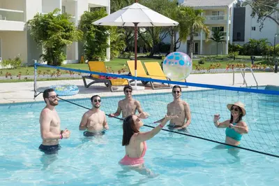 a group of people playing in a swimming pool at Emotions by Hodelpa Puerto Plata in San Felipe de Puerto Plata