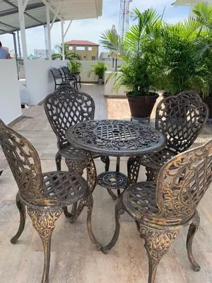 a table and four chairs and a table and chairs at KSL Residence in Boca Chica