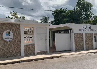 a hoteltennis hall with its doors open on a street at Hotel Pedernales Italia Republica Dominicana in Pedernales