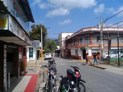 a group of motorcycles parked on the side of a street at Hostel Quintonido in Jarabacoa