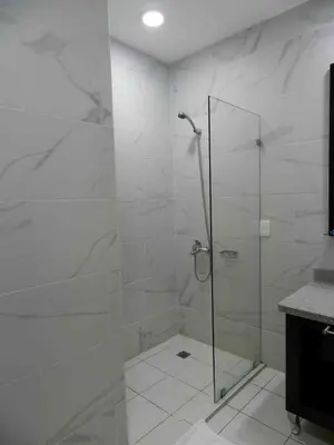 a shower with a glass door in a bathroom at MON Hotel Boutique in Constanza