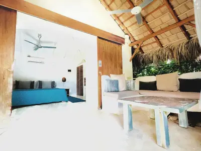 a living room with a couch and a table at Casa Picaflor B&B in Las Terrenas