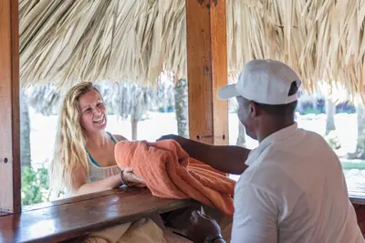 a woman is smiling as a man at Playabachata in San Felipe de Puerto Plata