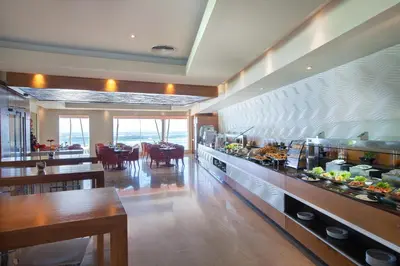 a restaurant with a buffet line with food on it at Majestic Elegance Punta Cana - All Inclusive in Punta Cana