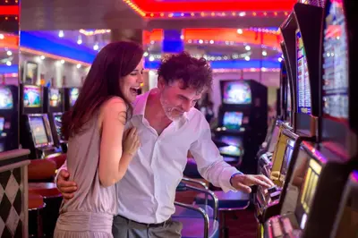 a man and a woman playing a video game in a casino at Majestic Elegance Punta Cana - All Inclusive in Punta Cana