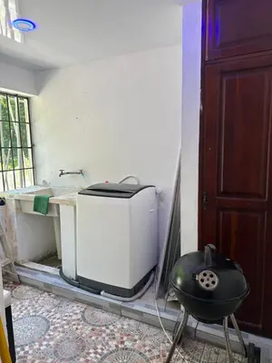 a room with a toaster sitting in the corner of a room at Mar azul 401 in San Felipe de Puerto Plata