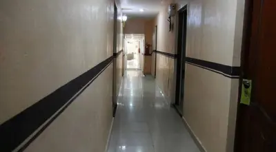 a hallway in a building with a long corridor at Hotel Luis V Santo Domingo in Santo Domingo