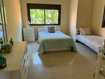 a bedroom with two beds and a window at Residencial Green Paradise at Metro Country Club Juan Dolio - 2 Bedroom with Balcony in Juan Dolio
