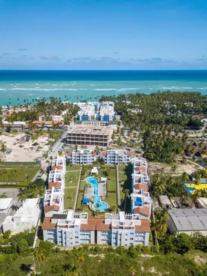 an aerial view of a resort near the ocean at Caribbean Treasure in Punta Cana