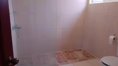 a bathroom with a shower with a toilet at Casa D9 in Santo Domingo