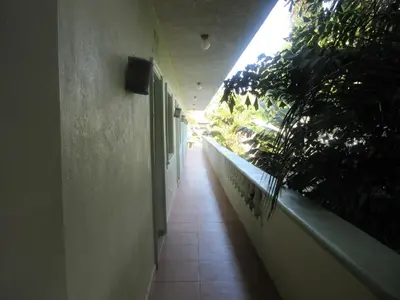 a hallway of a building with plants on the side at Hotel Cambri in Nagua