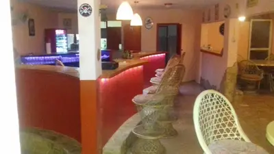 a bar with chairs and a counter in a restaurant at Casa Picadilly in Boca Chica