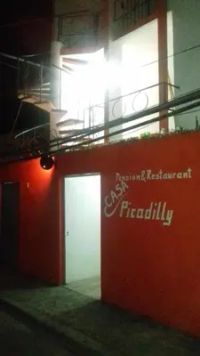 a building with a fireully sign on the side of it at Casa Picadilly in Boca Chica