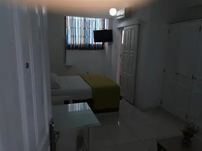 a small room with a bed and a television at Royal Palace Hotel in Santo Domingo