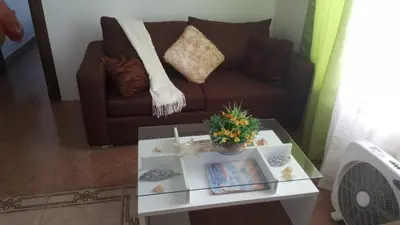 a living room with a couch and a coffee table at Apartamento Frente Al Mar in San Felipe de Puerto Plata