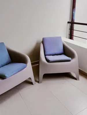 two chairs sitting next to each other in a waiting room at Comfortable Apartment in Caribbean Paradise in Sosúa
