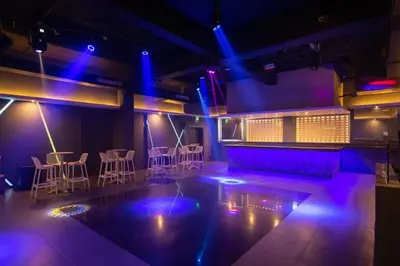 a room with purple lights and tables and chairs at Casa Marina Sosua, Trademark by Wyndham All Inclusive in Sosúa