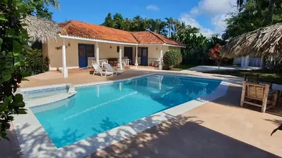 a swimming pool in front of a house at Casa Giò in Las Terrenas