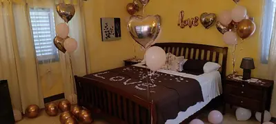 a childs bedroom with balloons and a bed with a crib at Casa Giò in Las Terrenas