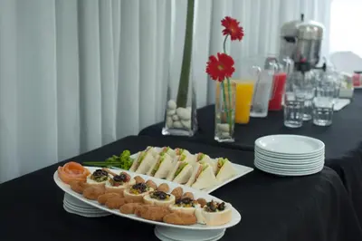 a table with two plates of food on a table at Hotel Aladino in Santo Domingo
