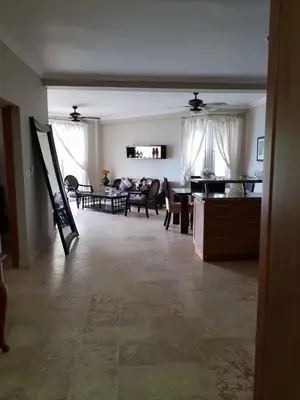 a living room with a dining room and a living room at Luxury Oceanview Condo 2 BR/2.5 BA in Sosúa