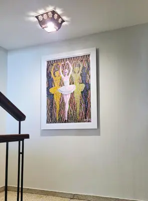 a painting of a woman on a wall at Hotel Olimpo in La Romana