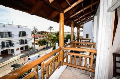 a balcony with a view of a street at Palma Real in Bayahibe