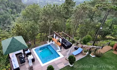 an overhead view of a swimming pool in a backyard at Villa The sky village in Jarabacoa
