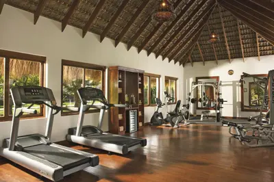 a gym with cardio equipment in a villa at Zoetry Agua Punta Cana - All Inclusive in Punta Cana