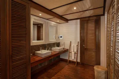 a bathroom with two sinks and a mirror at Zoetry Agua Punta Cana - All Inclusive in Punta Cana
