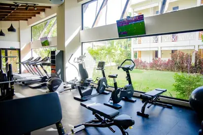 a gym with a bunch of exercise bikes in a room at Vista Sol Punta Cana Beach Resort & Spa - All Inclusive in Punta Cana