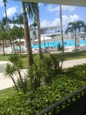 a view of the pool from the balcony of a resort at 1 Sol Dominicus Solo Adultos Habitación con Entrada Independiente y Baño Privado in Bayahibe