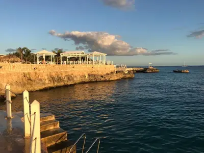 a group of buildings on the shore of the water at 1 Sol Dominicus Solo Adultos Habitación con Entrada Independiente y Baño Privado in Bayahibe